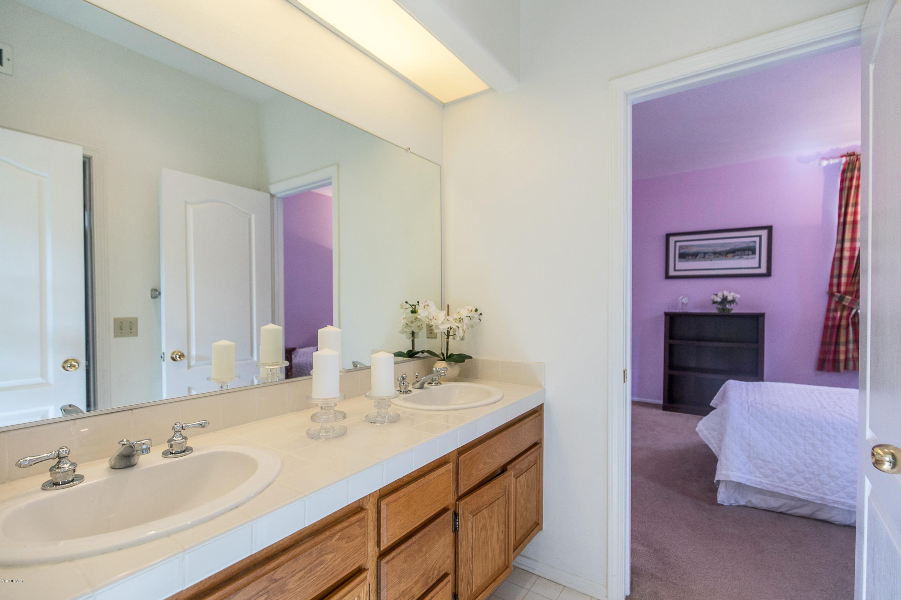 3959 Timberridge Road Moorpark, CA 93021 - Photo 31 of 48 a en suite bathroom with a double vanity sink and a mirror
