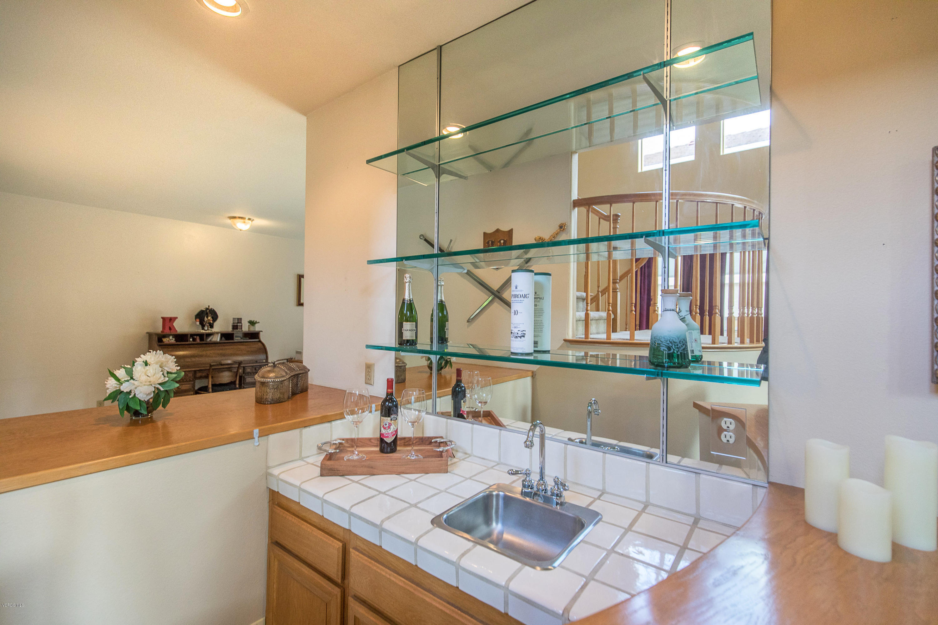3959 Timberridge Road Moorpark, CA 93021 - Photo 10 of 48 a bathroom with a granite countertop sink and a large mirror
