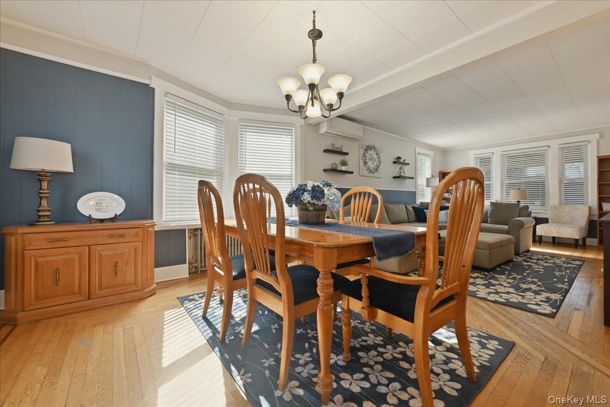 1165 Meadowbrook Road Merrick, NY 11566 - Photo 11 of 36 a view of a dining room with furniture and chandelier