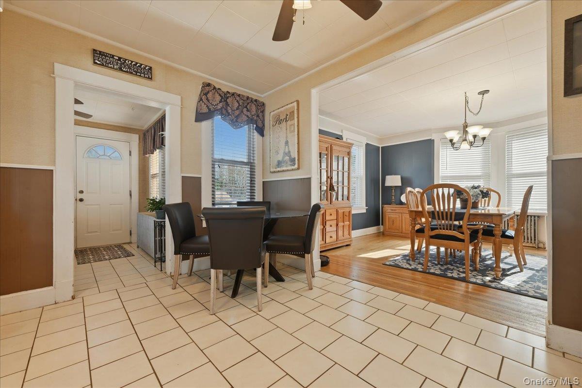 1165 Meadowbrook Road Merrick, NY 11566 - Photo 14 of 36 a view of a dining room with furniture