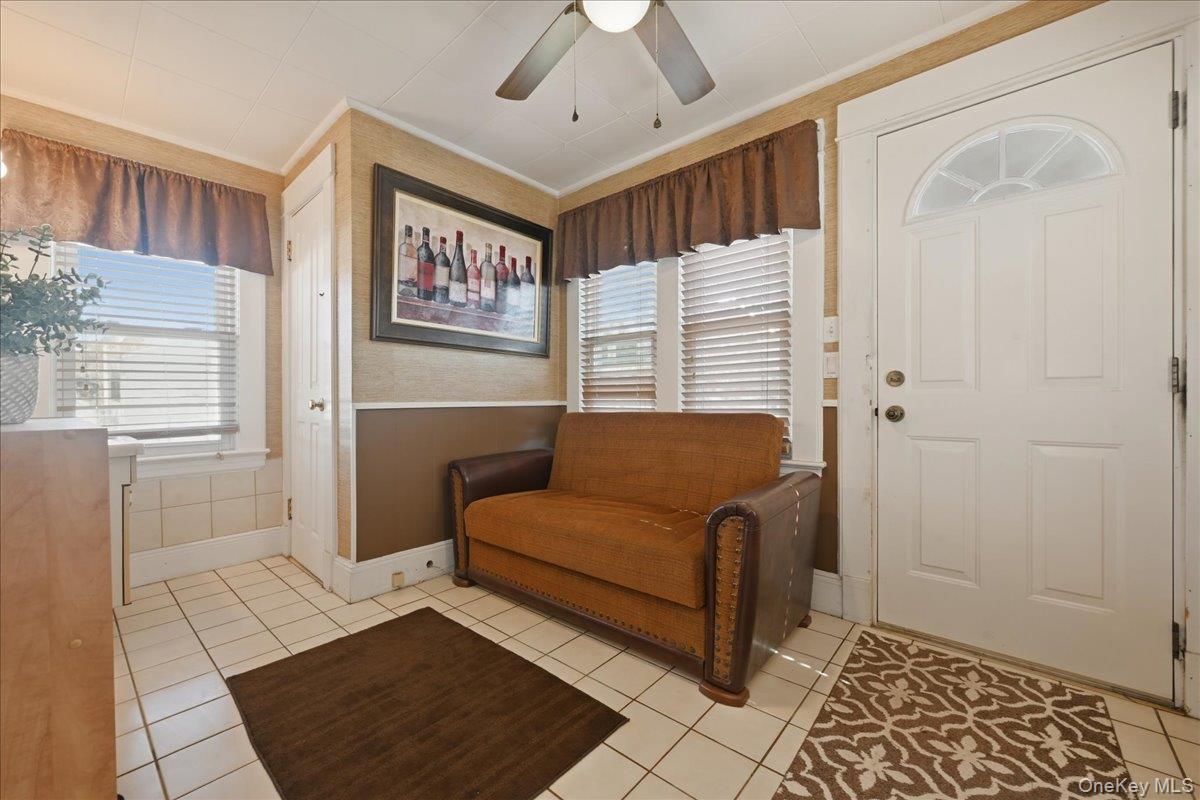 1165 Meadowbrook Road Merrick, NY 11566 - Photo 18 of 36 a bedroom with a bed and a window