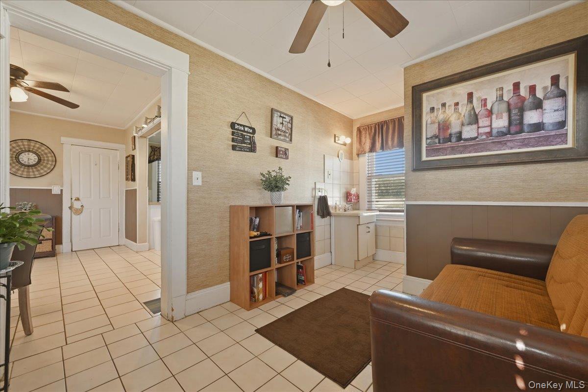 1165 Meadowbrook Road Merrick, NY 11566 - Photo 19 of 36 a view of a livingroom with furniture and an empty room