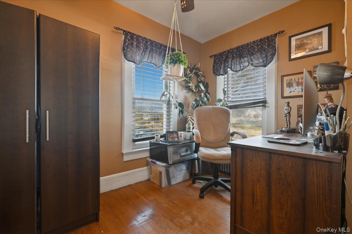 1165 Meadowbrook Road Merrick, NY 11566 - Photo 21 of 36 a view of a workspace with furniture and a window