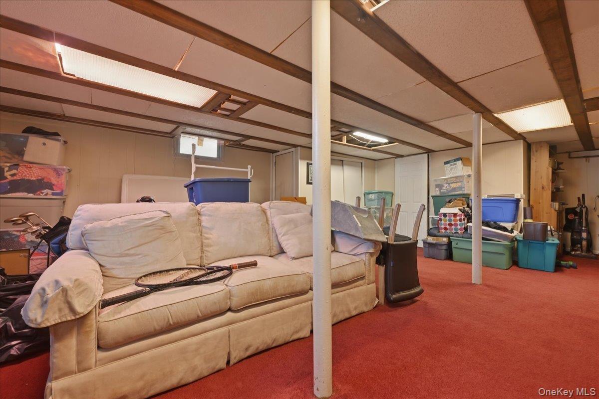 1165 Meadowbrook Road Merrick, NY 11566 - Photo 28 of 36 a living room with furniture