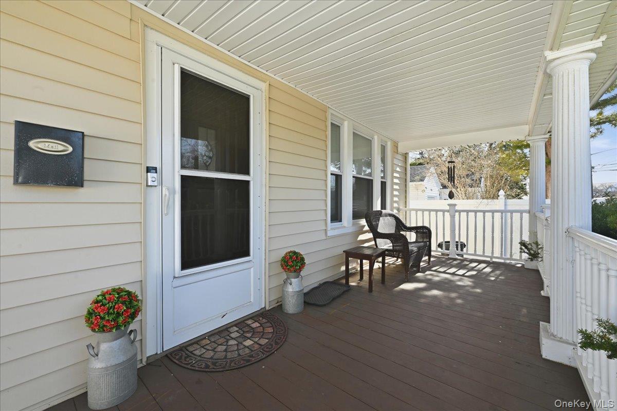 1165 Meadowbrook Road Merrick, NY 11566 - Photo 4 of 36 a view of a porch with furniture