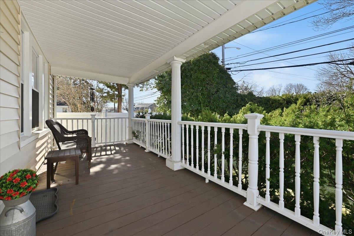 1165 Meadowbrook Road Merrick, NY 11566 - Photo 5 of 36 a view of a two chairs and table in the balcony