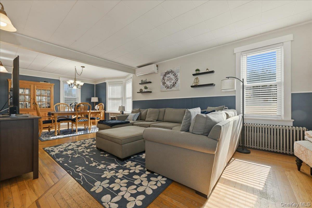 1165 Meadowbrook Road Merrick, NY 11566 - Photo 7 of 36 a living room with furniture