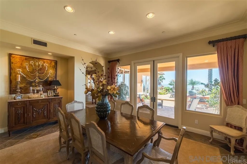 17847 Punta Del Sur Rancho Santa Fe, CA 92067 - Photo 11 of 14 a view of a dining room with furniture window and outside view