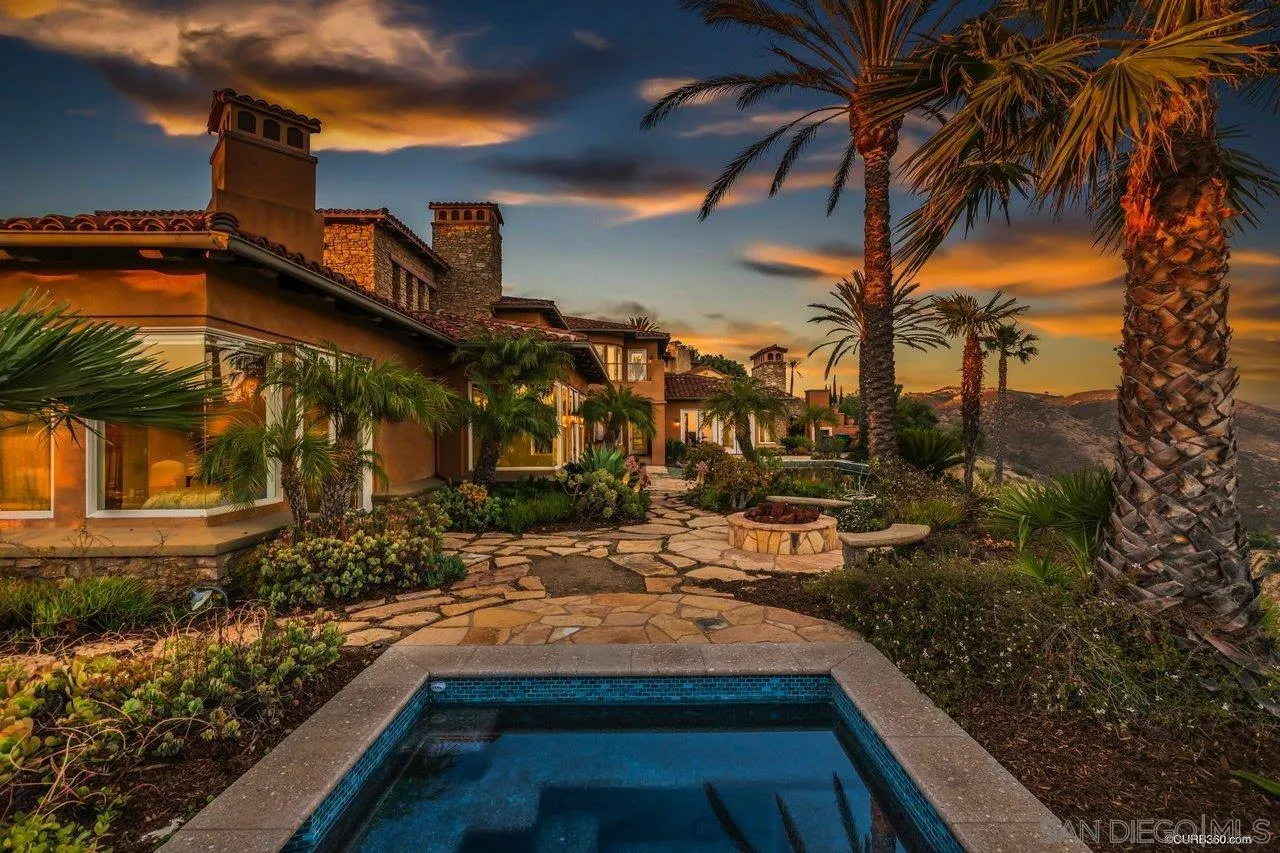 17847 Punta Del Sur Rancho Santa Fe, CA 92067 - Photo 4 of 14 a view of a house with a yard and tree s