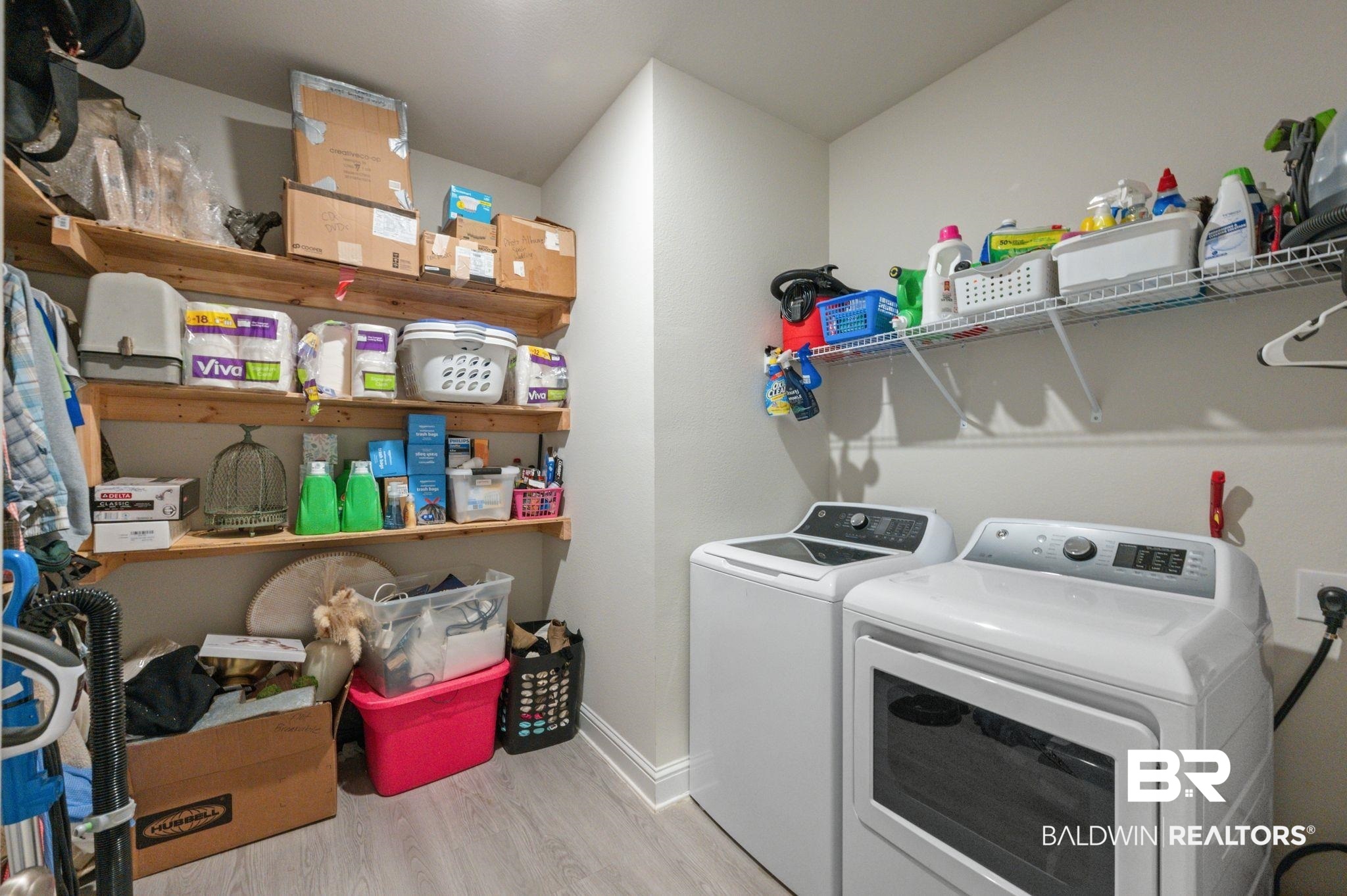 681 Calibre Street Fairhope, AL 36532 - Photo 47 of 56 Clothes washing area featuring separate washer and dryer and light hardwood / wood-style flooring