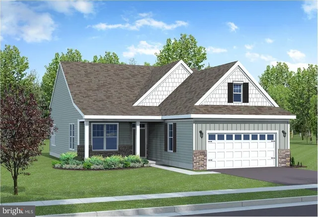 a view of a house with a yard and potted plants