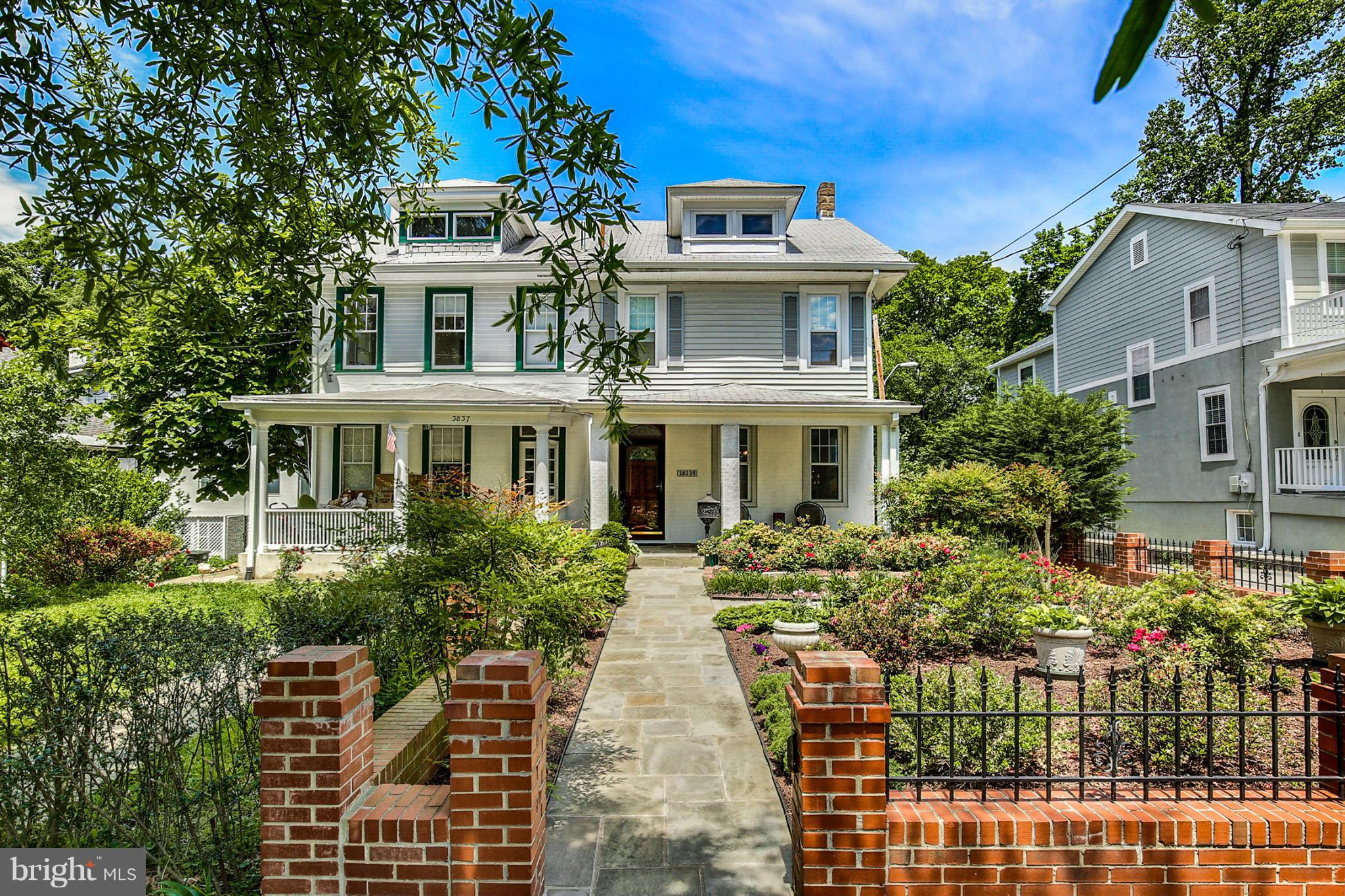 a front view of a residential apartment building with a yard