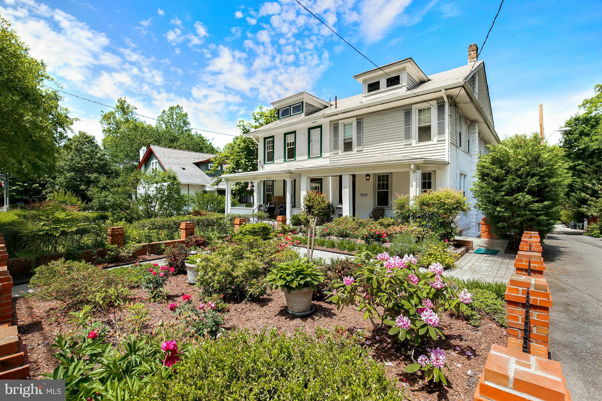 3835 Military Road Northwest Washington, DC 20015 - Photo 2 of 28 a view of a house with a yard and garden