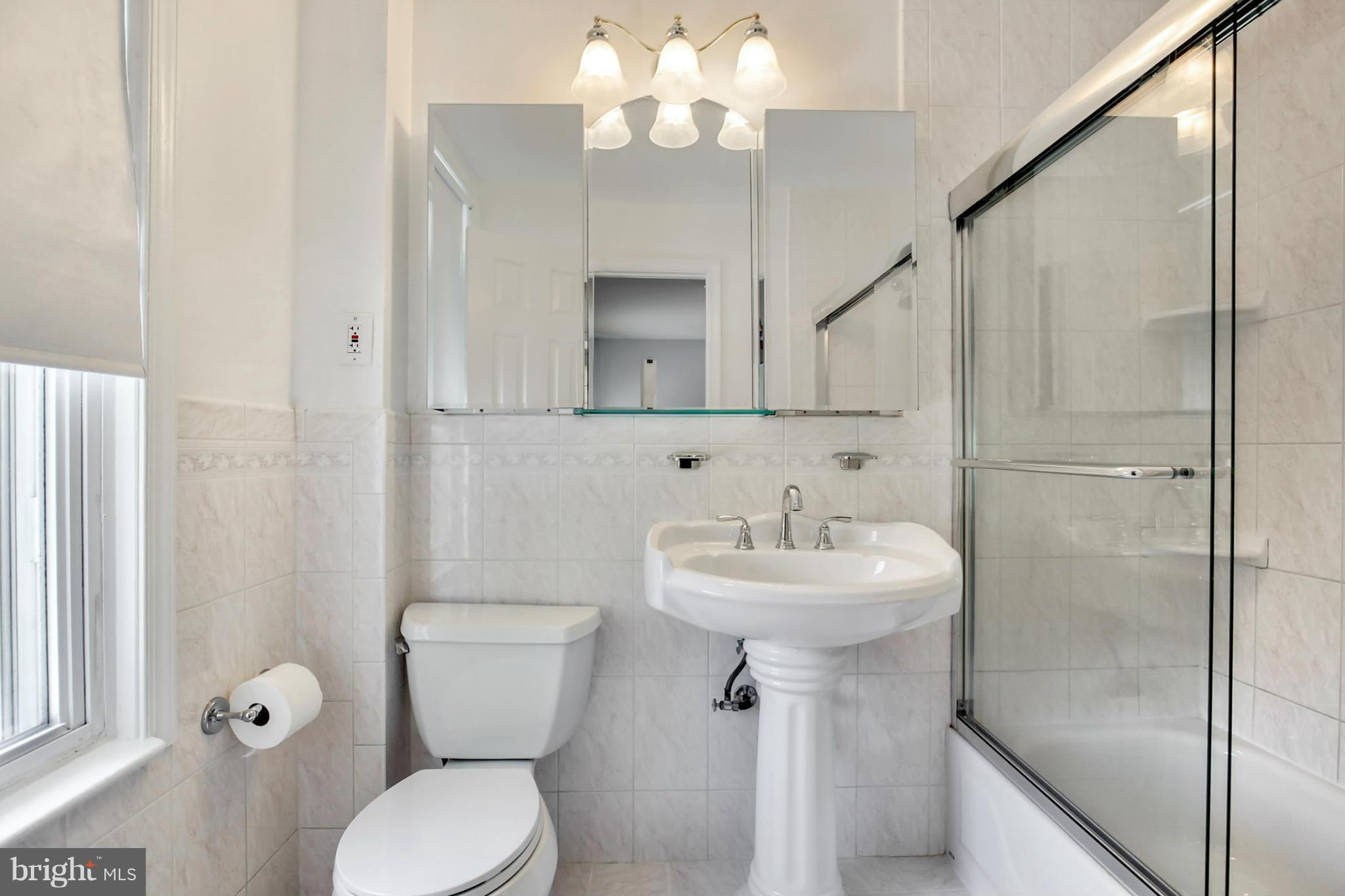 3835 Military Road Northwest Washington, DC 20015 - Photo 16 of 28 a bathroom with a sink toilet and shower