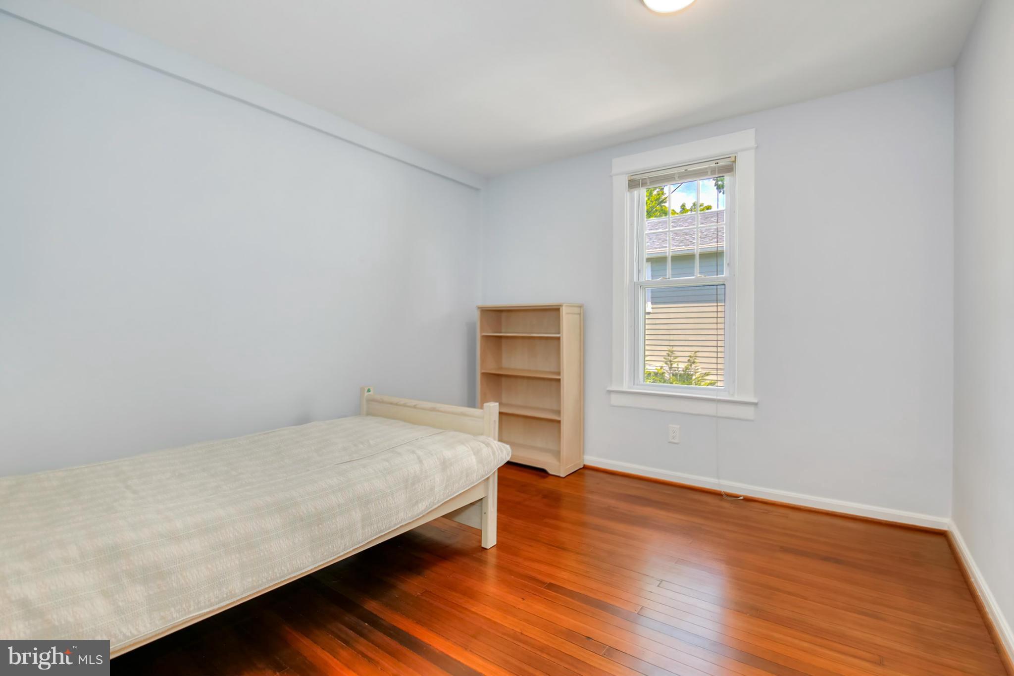 3835 Military Road Northwest Washington, DC 20015 - Photo 17 of 28 a bedroom with a bed and a window
