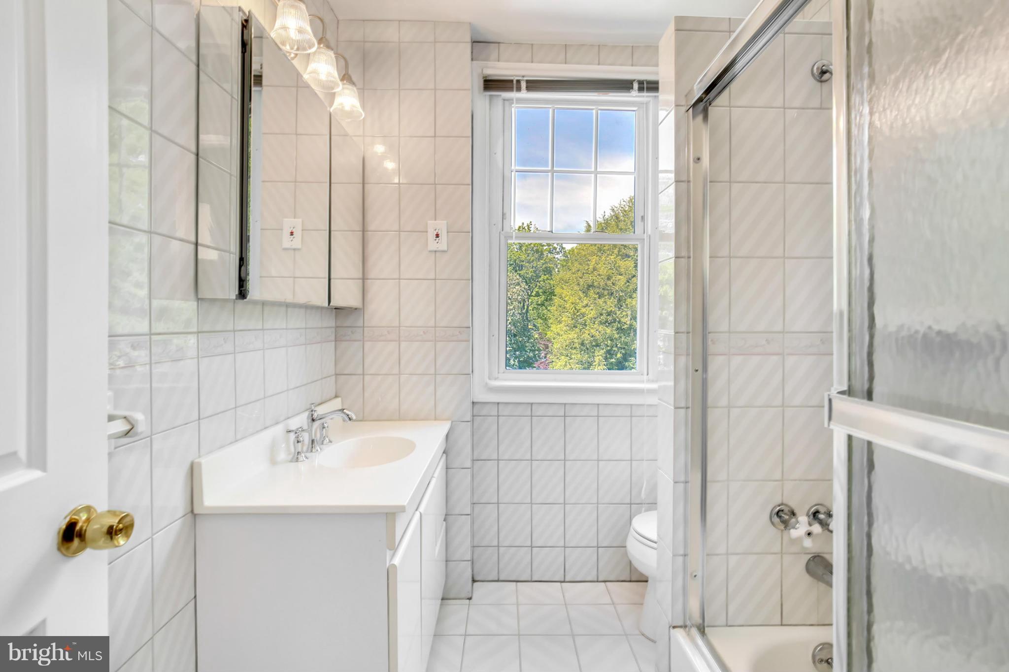 3835 Military Road Northwest Washington, DC 20015 - Photo 19 of 28 a bathroom with a shower and a sink