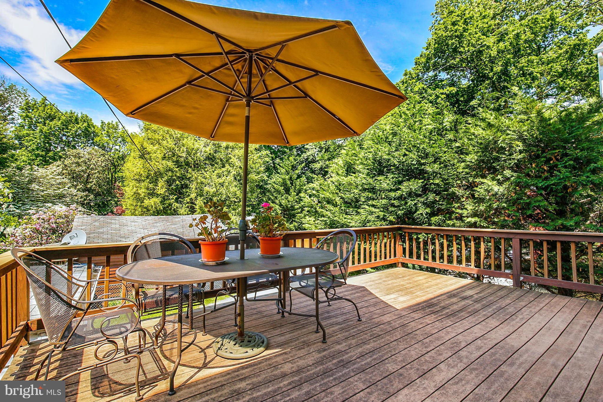 3835 Military Road Northwest Washington, DC 20015 - Photo 25 of 28 a view of balcony with wooden floor and outdoor seating