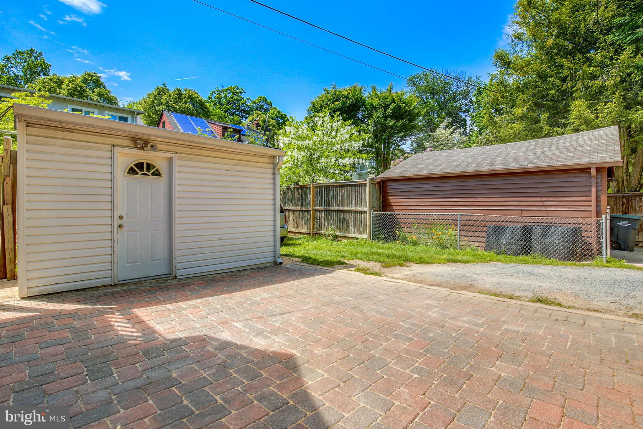 3835 Military Road Northwest Washington, DC 20015 - Photo 28 of 28 a view of a house with a yard and garage