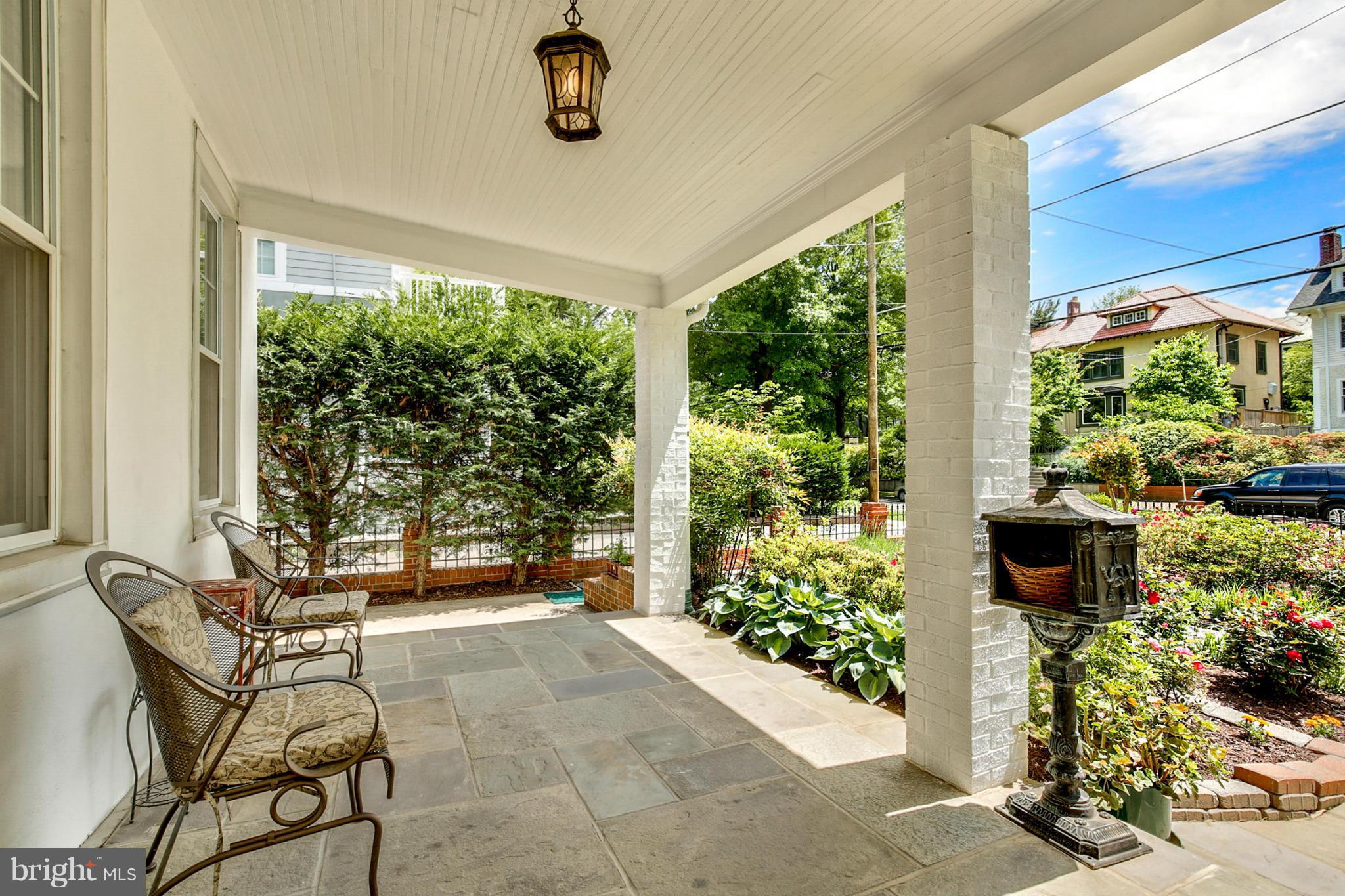 3835 Military Road Northwest Washington, DC 20015 - Photo 4 of 28 a building outdoor space with patio furniture and potted plants