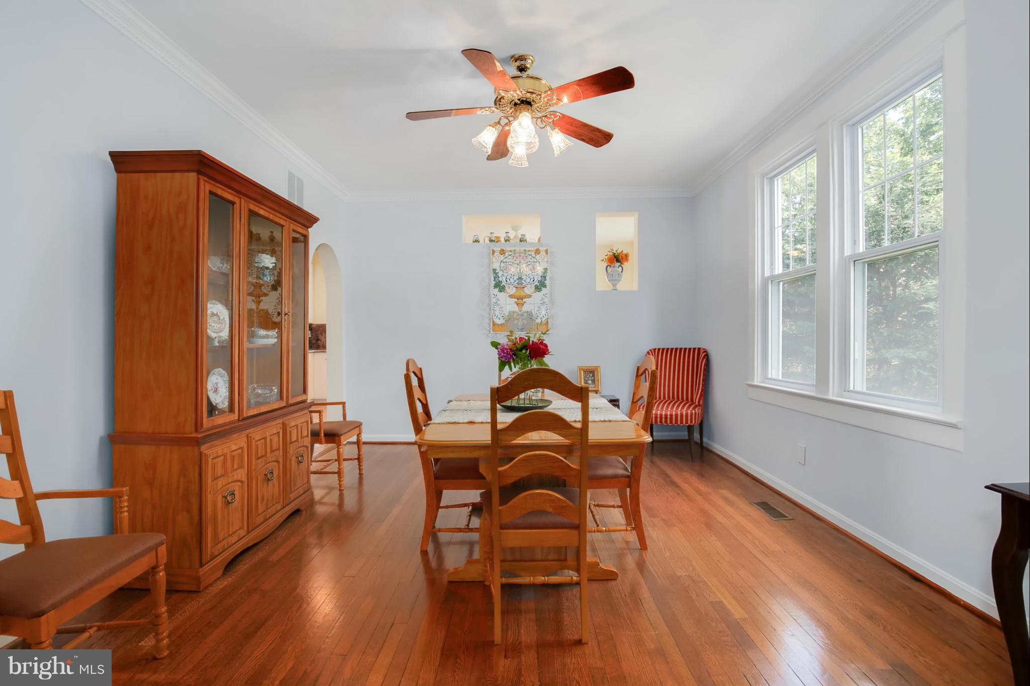 3835 Military Road Northwest Washington, DC 20015 - Photo 8 of 28 a dining room with furniture a chandelier and wooden floor
