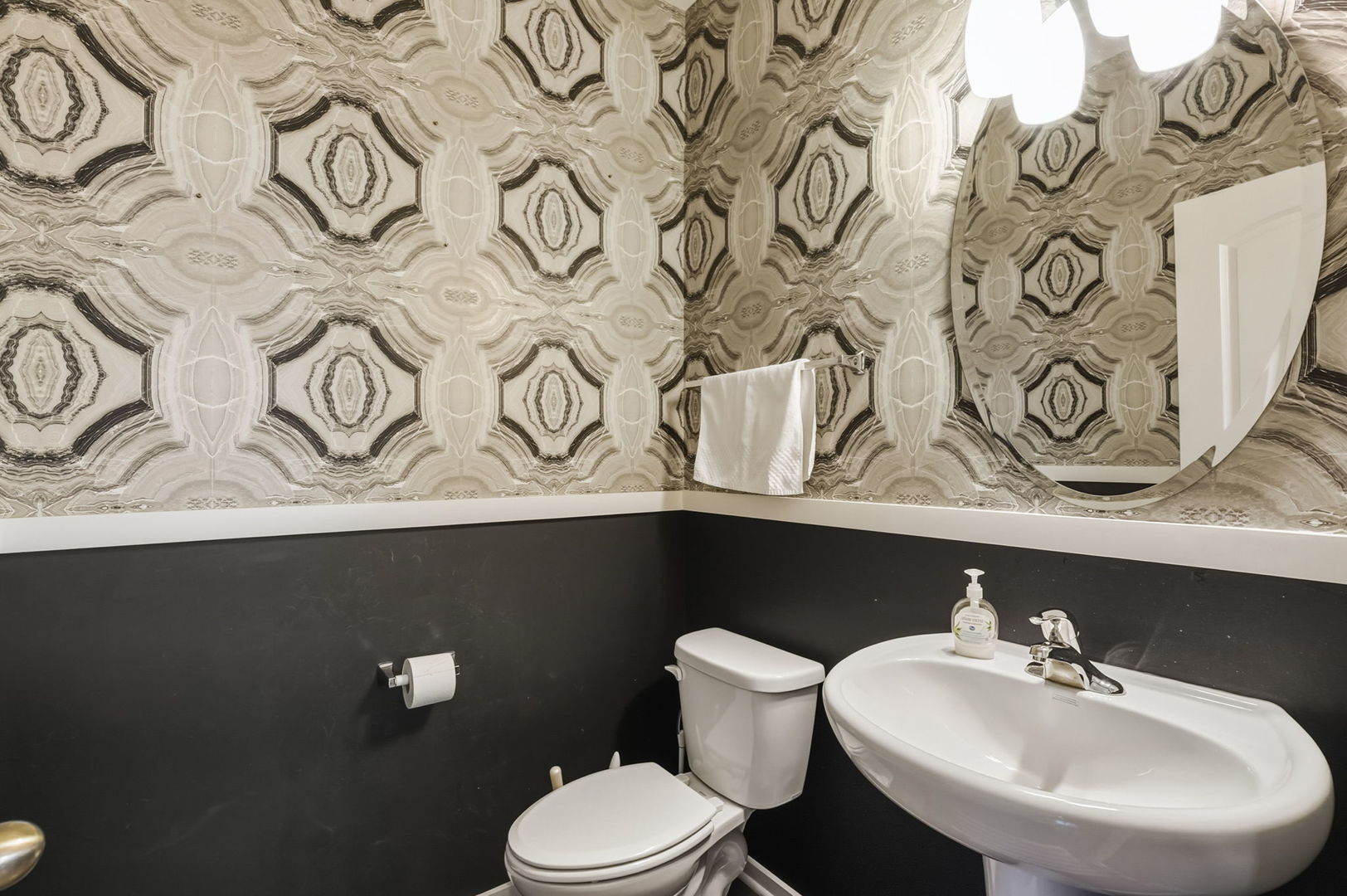 8536 Grove Street Morton Grove, IL 60053 - Photo 14 of 26 a bathroom with a sink and a toilet