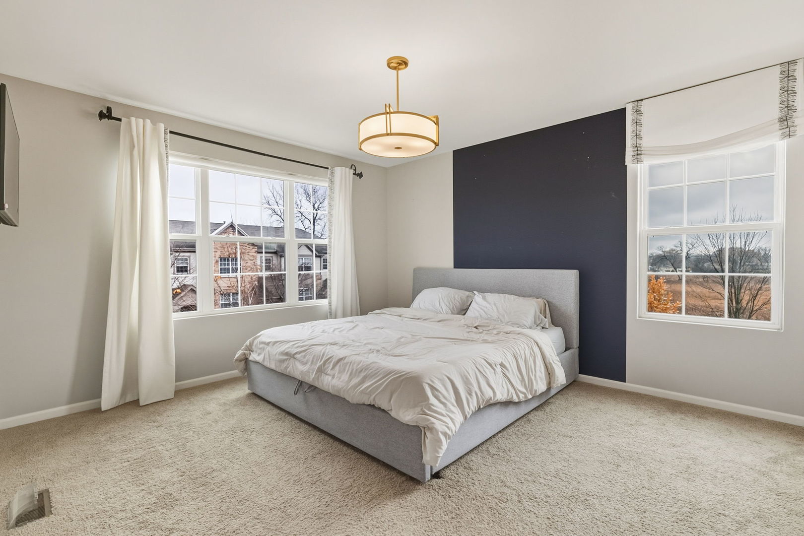 8536 Grove Street Morton Grove, IL 60053 - Photo 15 of 26 a bedroom with a large bed and a window