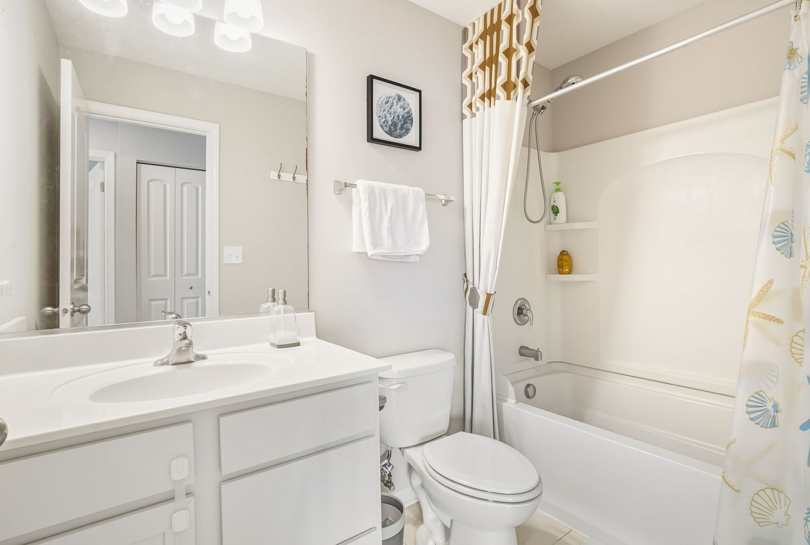 8536 Grove Street Morton Grove, IL 60053 - Photo 21 of 26 a bathroom with a sink a toilet and shower