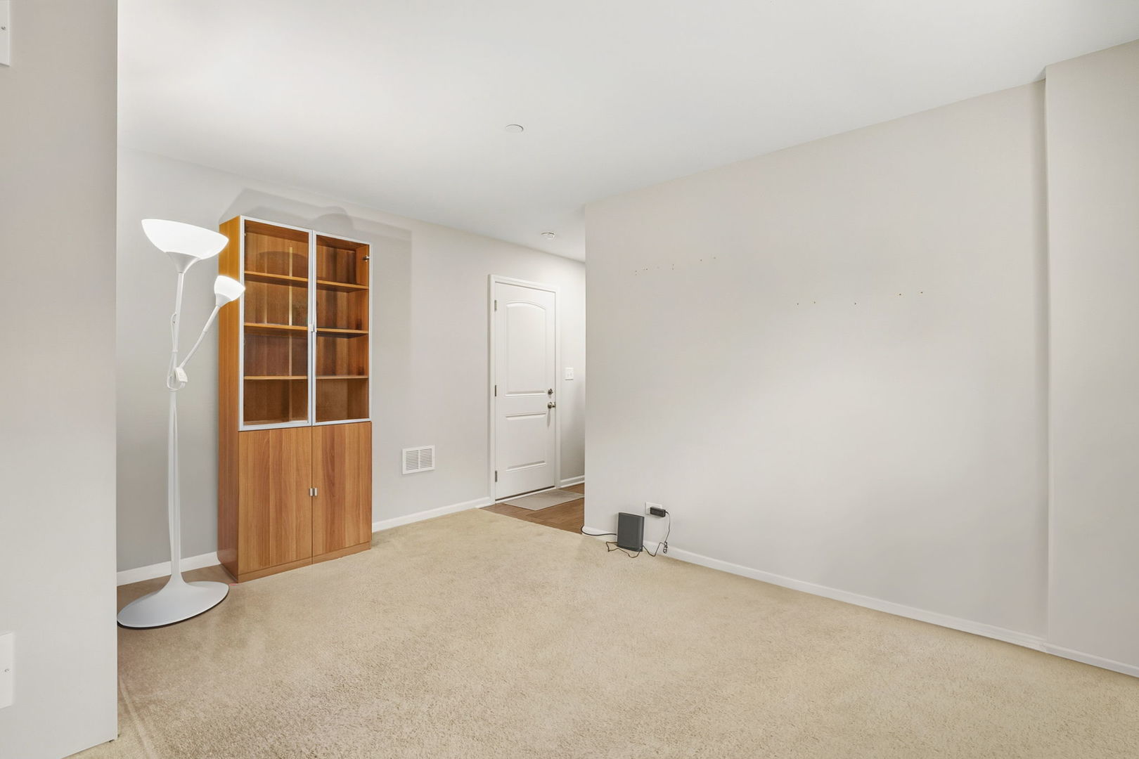8536 Grove Street Morton Grove, IL 60053 - Photo 24 of 26 an empty room with wooden floor and windows