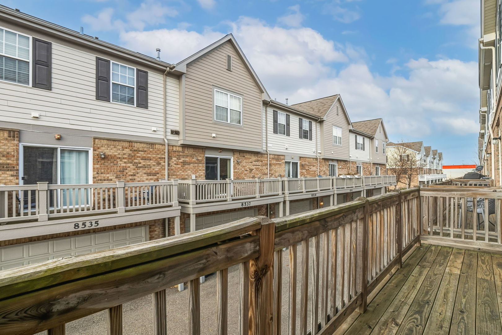 8536 Grove Street Morton Grove, IL 60053 - Photo 4 of 26 a view of a brick house with large windows
