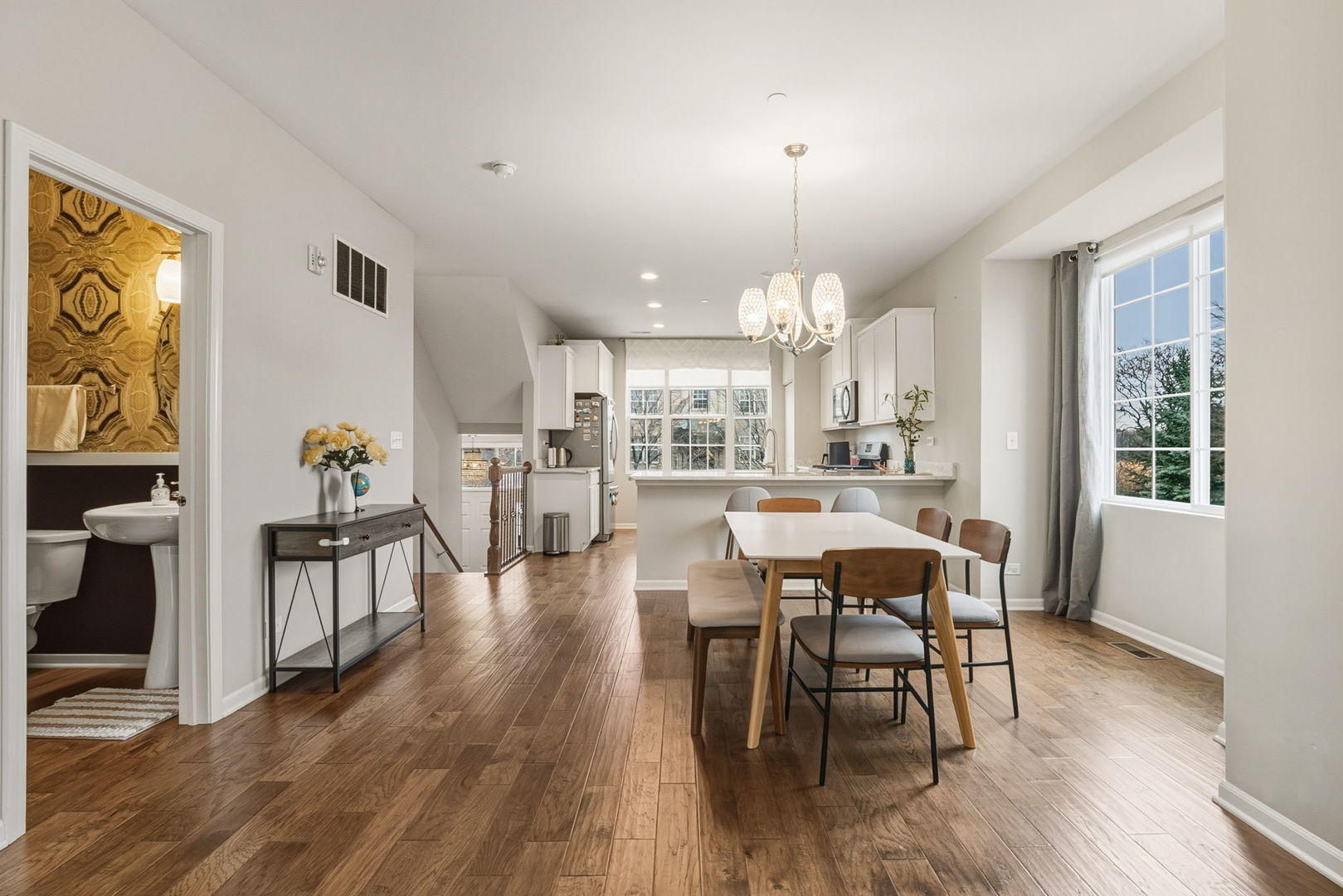 8536 Grove Street Morton Grove, IL 60053 - Photo 8 of 26 a view of a a dining room with furniture window and wooden floor