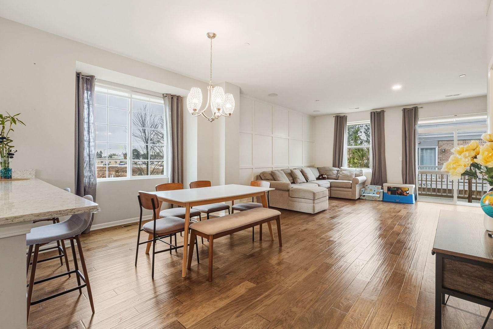 8536 Grove Street Morton Grove, IL 60053 - Photo 9 of 26 a living room with furniture a table and a large window