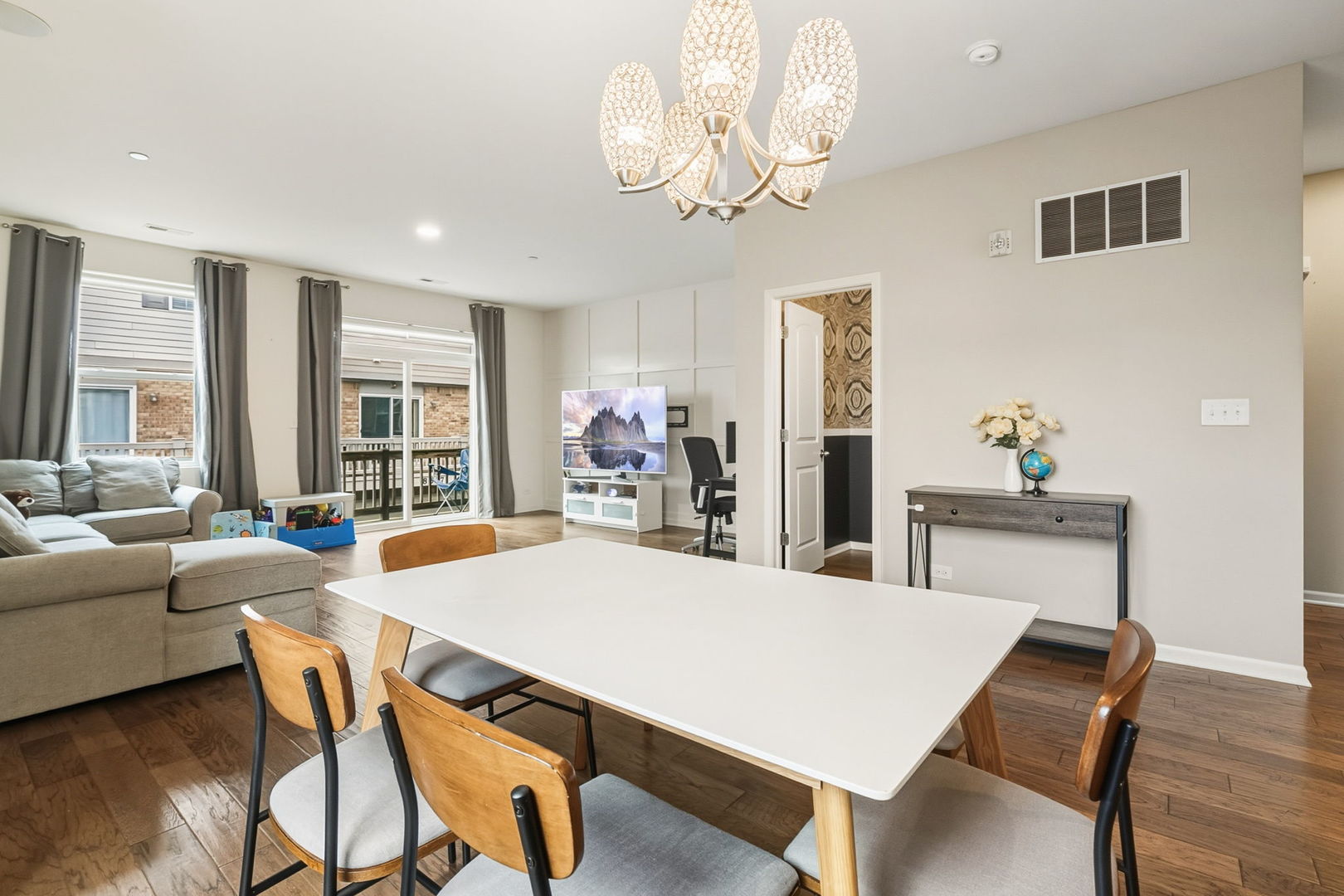 8536 Grove Street Morton Grove, IL 60053 - Photo 10 of 26 a view of a dining room with furniture window and wooden floor