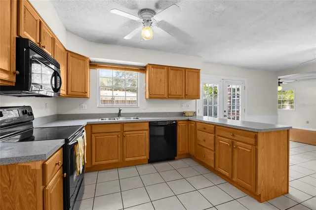 a kitchen with stainless steel appliances granite countertop a sink and cabinets
