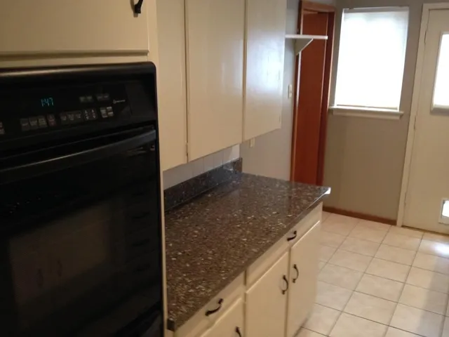 a view of a kitchen counter space and window