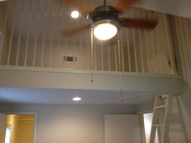 a kitchen with a sink and chandelier