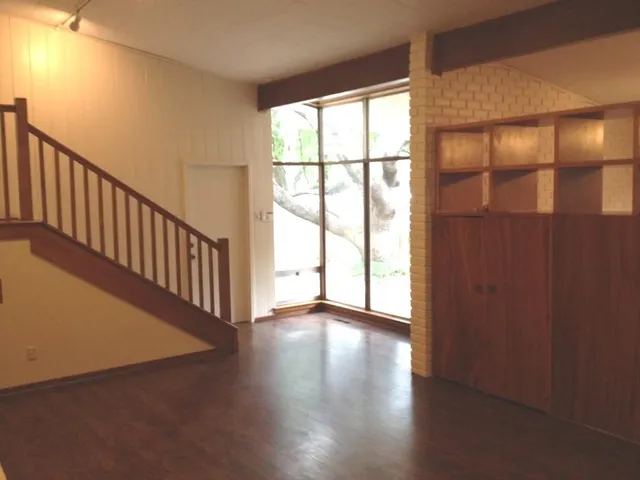 a view of an entryway with wooden floor