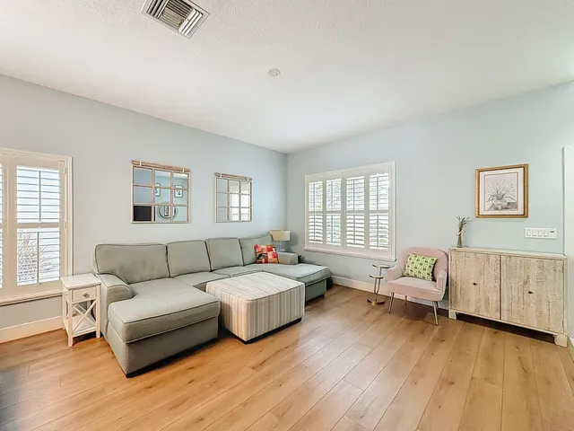 a bathroom with a granite countertop sink and a large mirror
