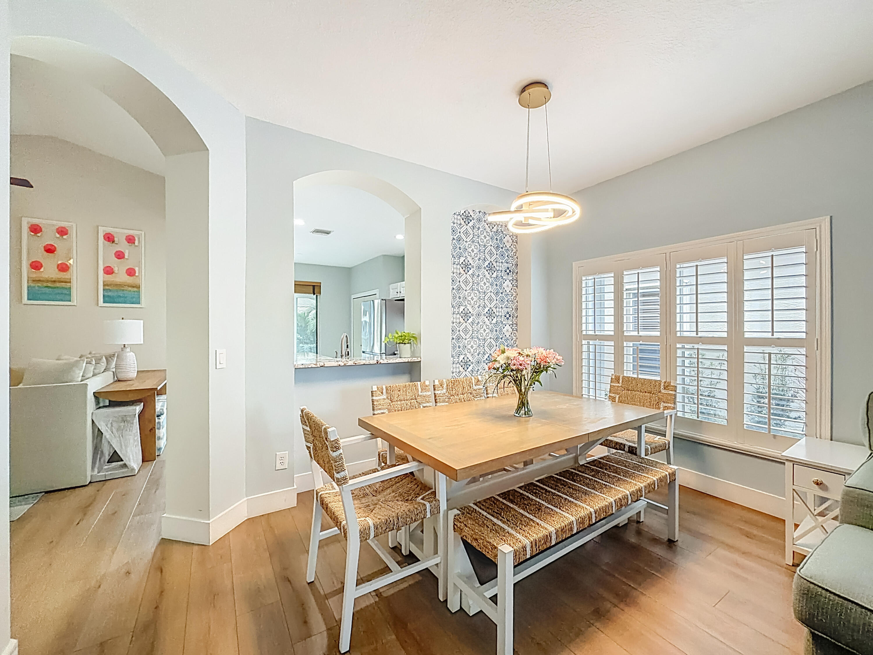 1143 Canoe Point Delray Beach, FL 33444 - Photo 16 of 85 a view of a dining room with furniture window and wooden floor
