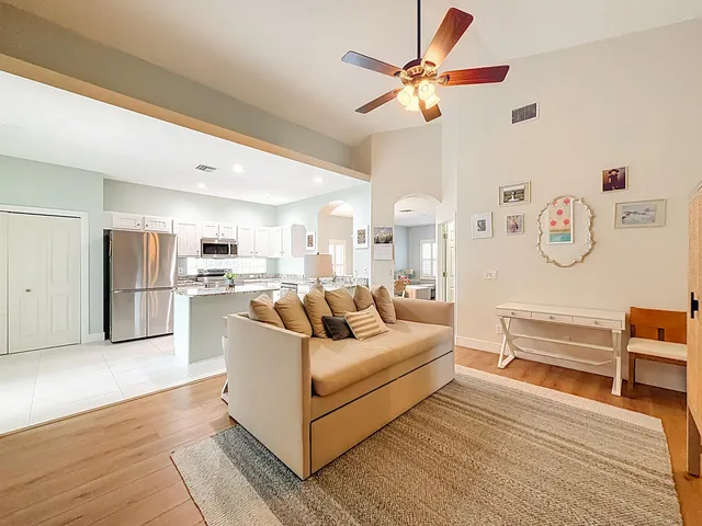 a kitchen with stainless steel appliances granite countertop a refrigerator a stove a sink and a microwave