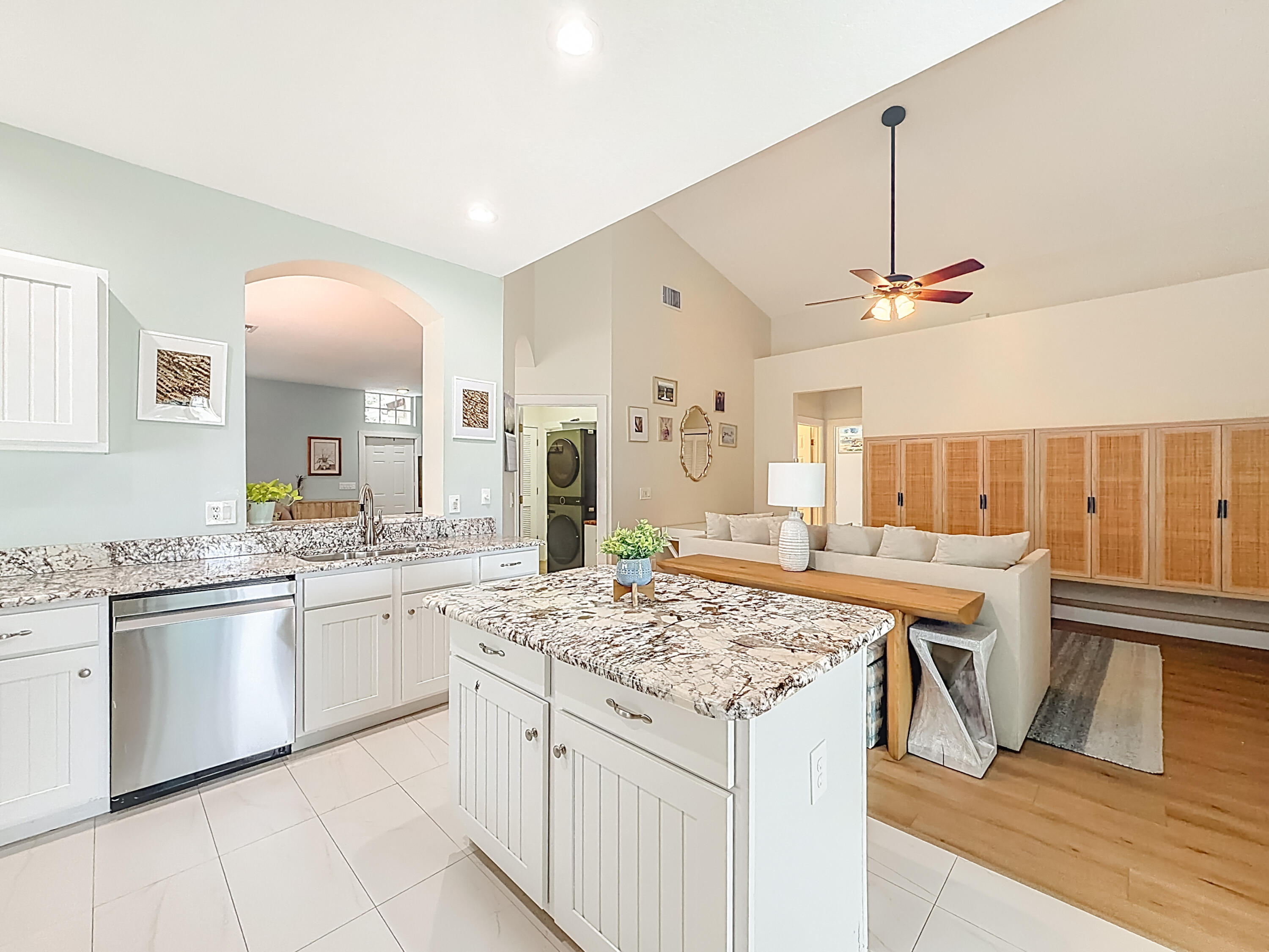 1143 Canoe Point Delray Beach, FL 33444 - Photo 22 of 85 a kitchen with stainless steel appliances granite countertop a sink and cabinets