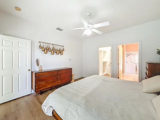 a view of a room that has a bed and a yard in the balcony