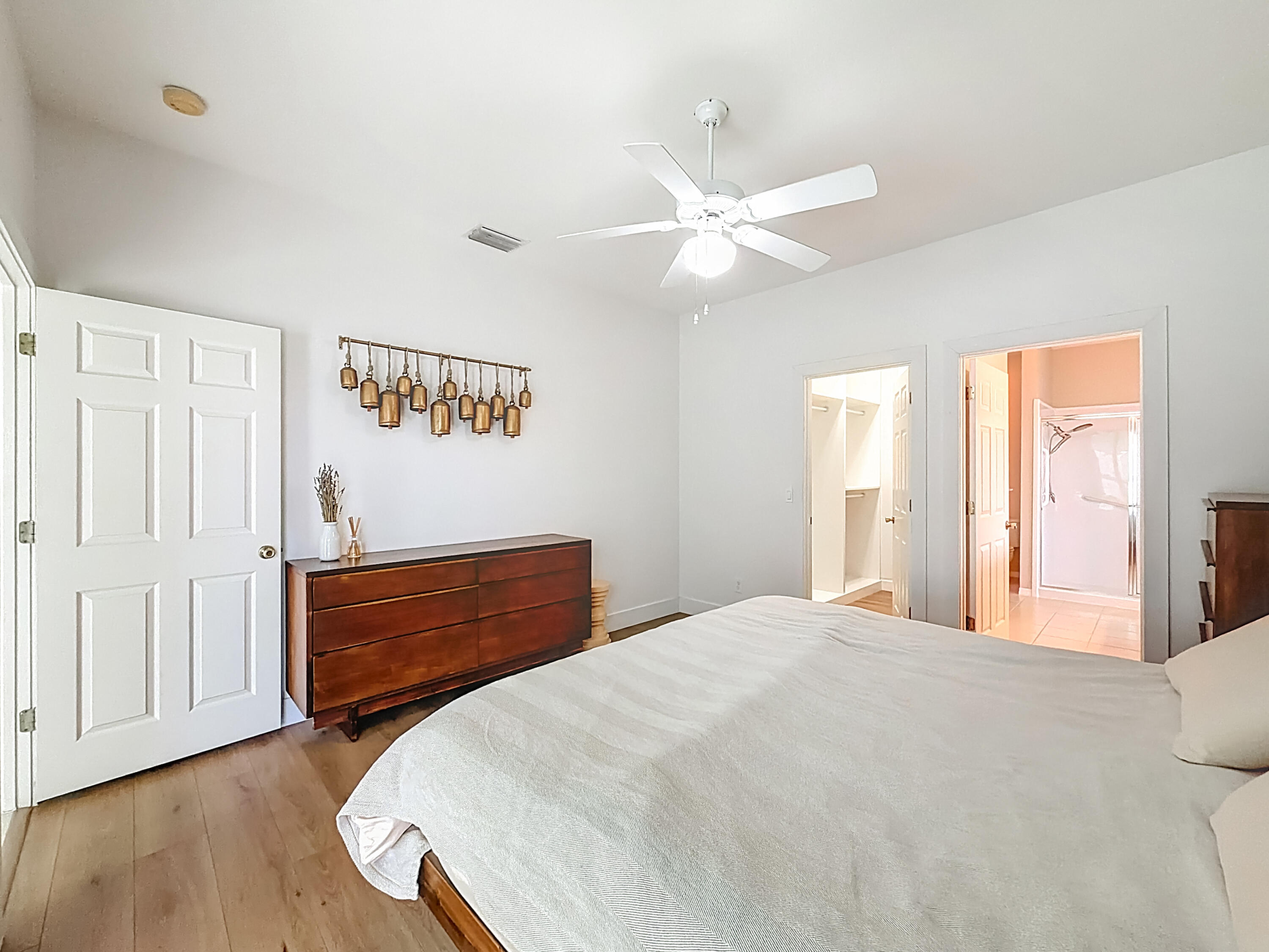 1143 Canoe Point Delray Beach, FL 33444 - Photo 37 of 85 a bedroom with a large bed and a chandelier