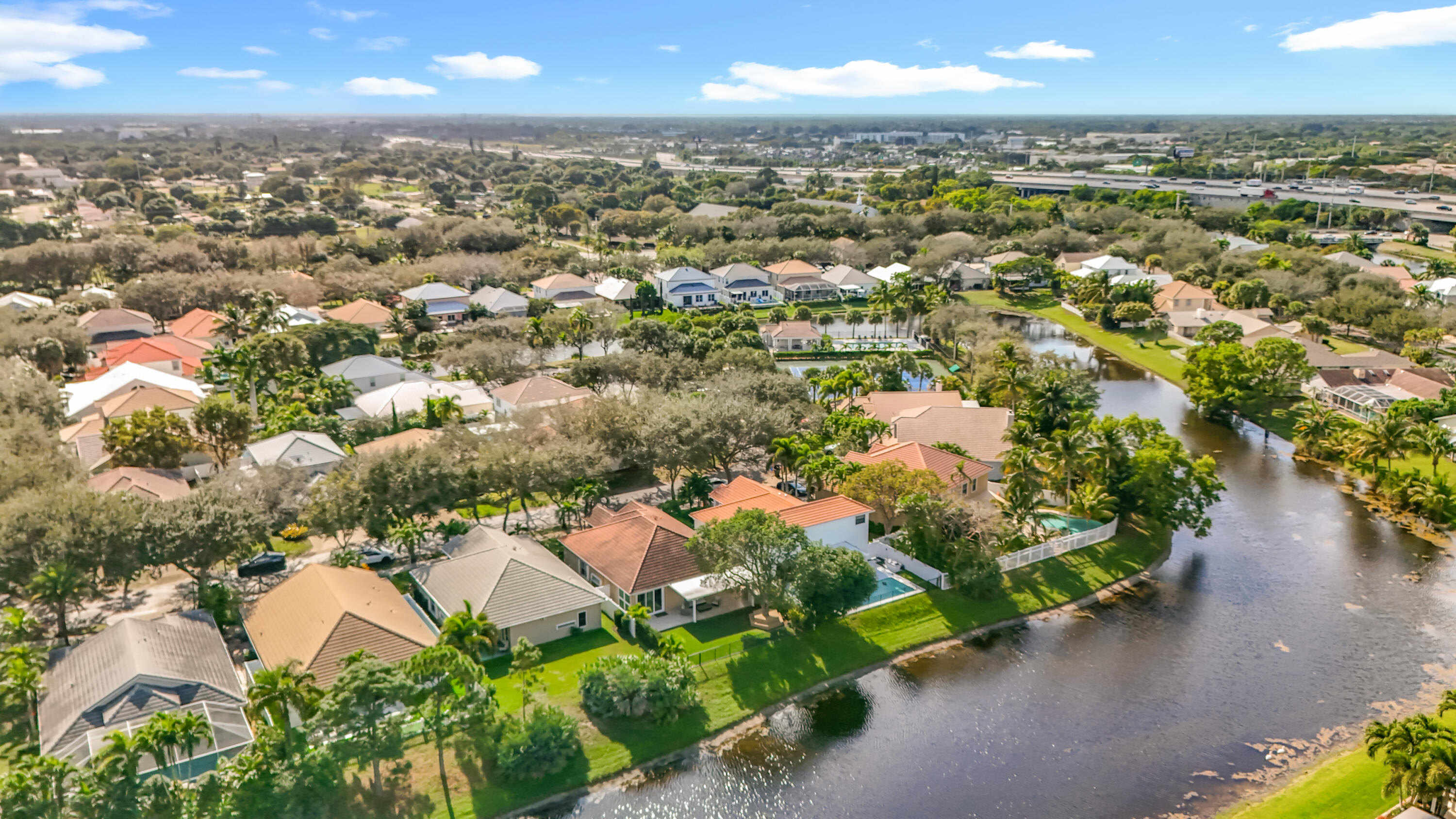 1143 Canoe Point Delray Beach, FL 33444 - Photo 4 of 85 an aerial view of residential houses with outdoor space and trees
