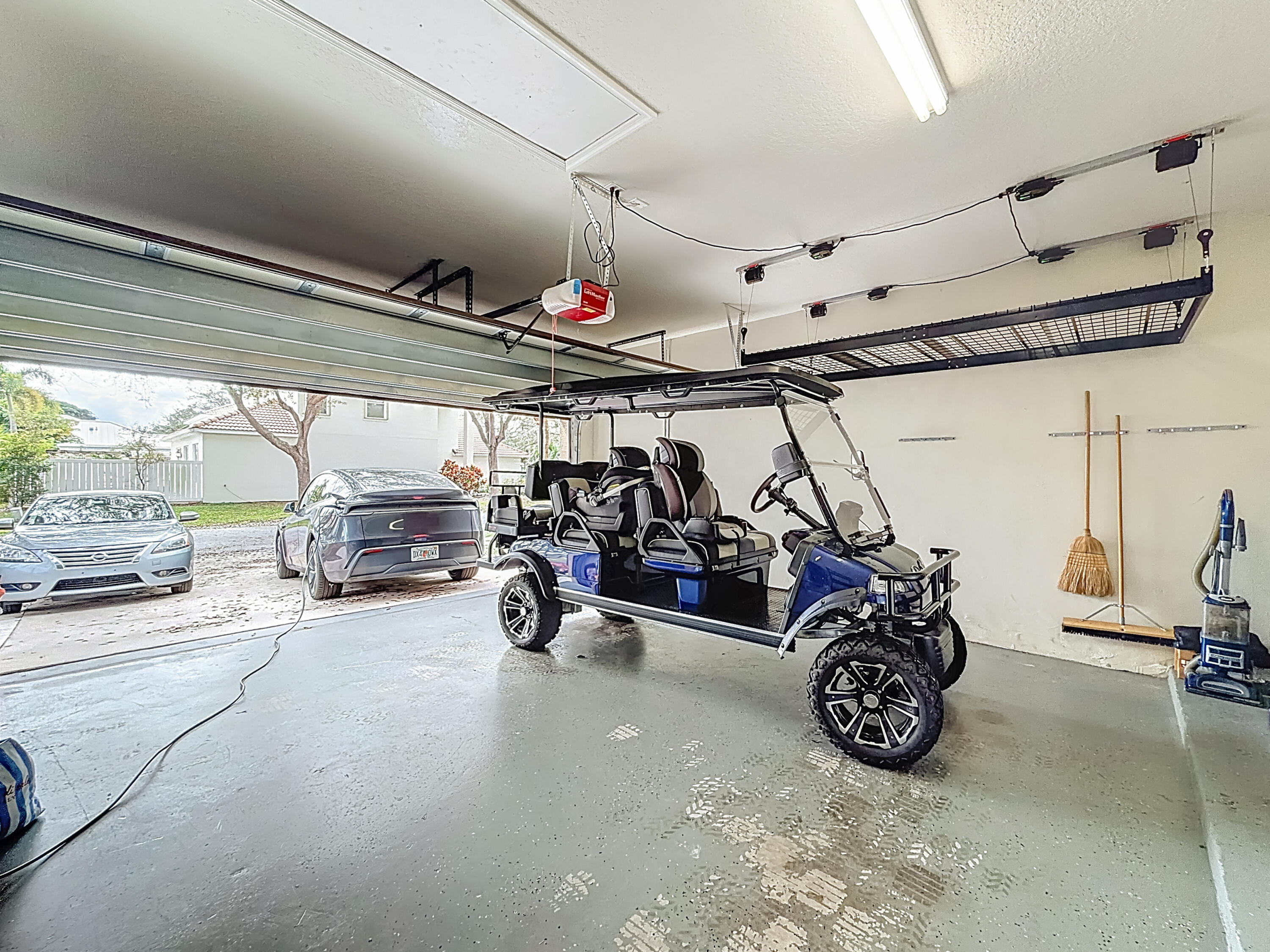 1143 Canoe Point Delray Beach, FL 33444 - Photo 61 of 85 a view of a garage with parked cars