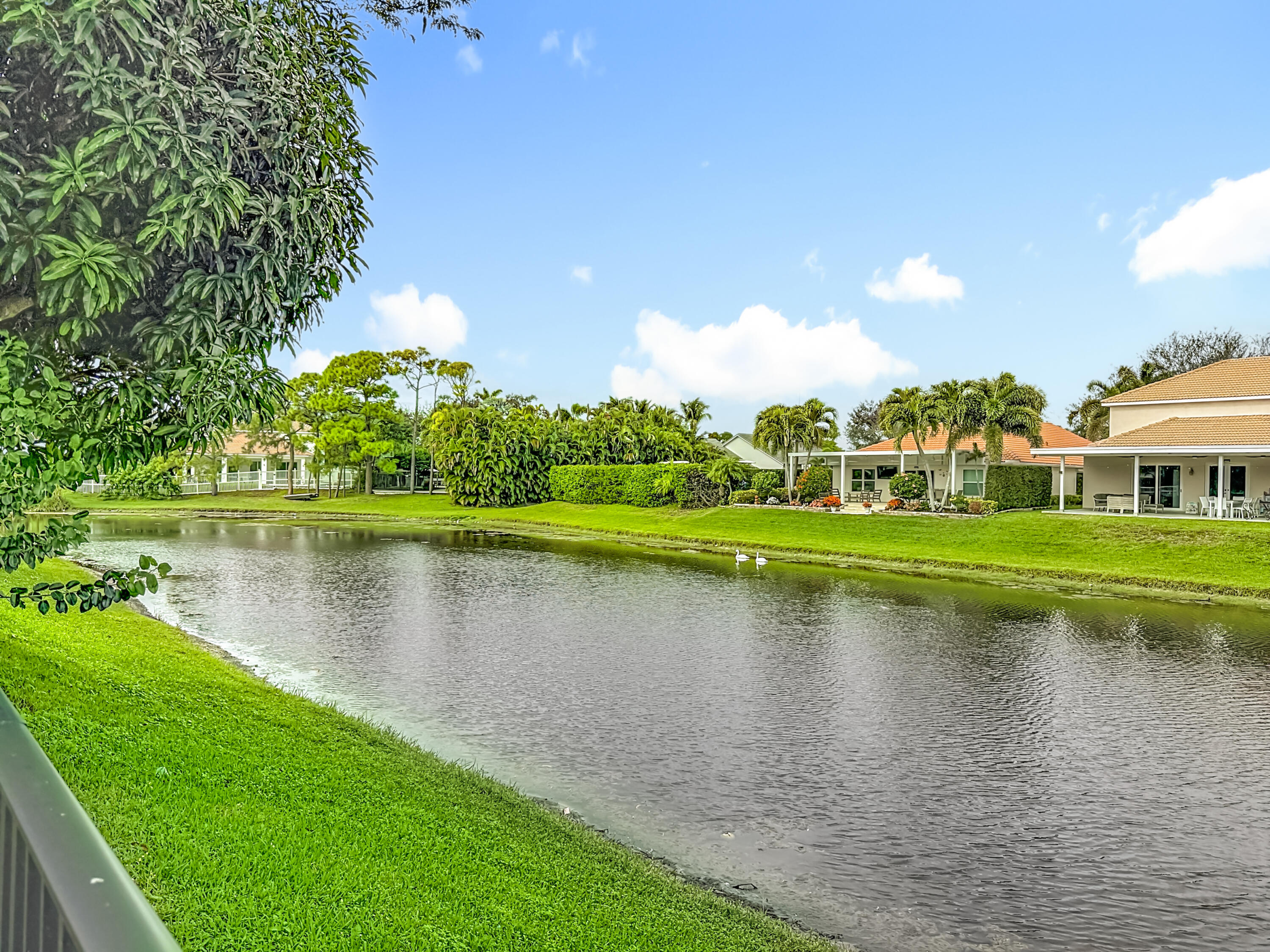 1143 Canoe Point Delray Beach, FL 33444 - Photo 71 of 85 a view of a lake with houses in the background