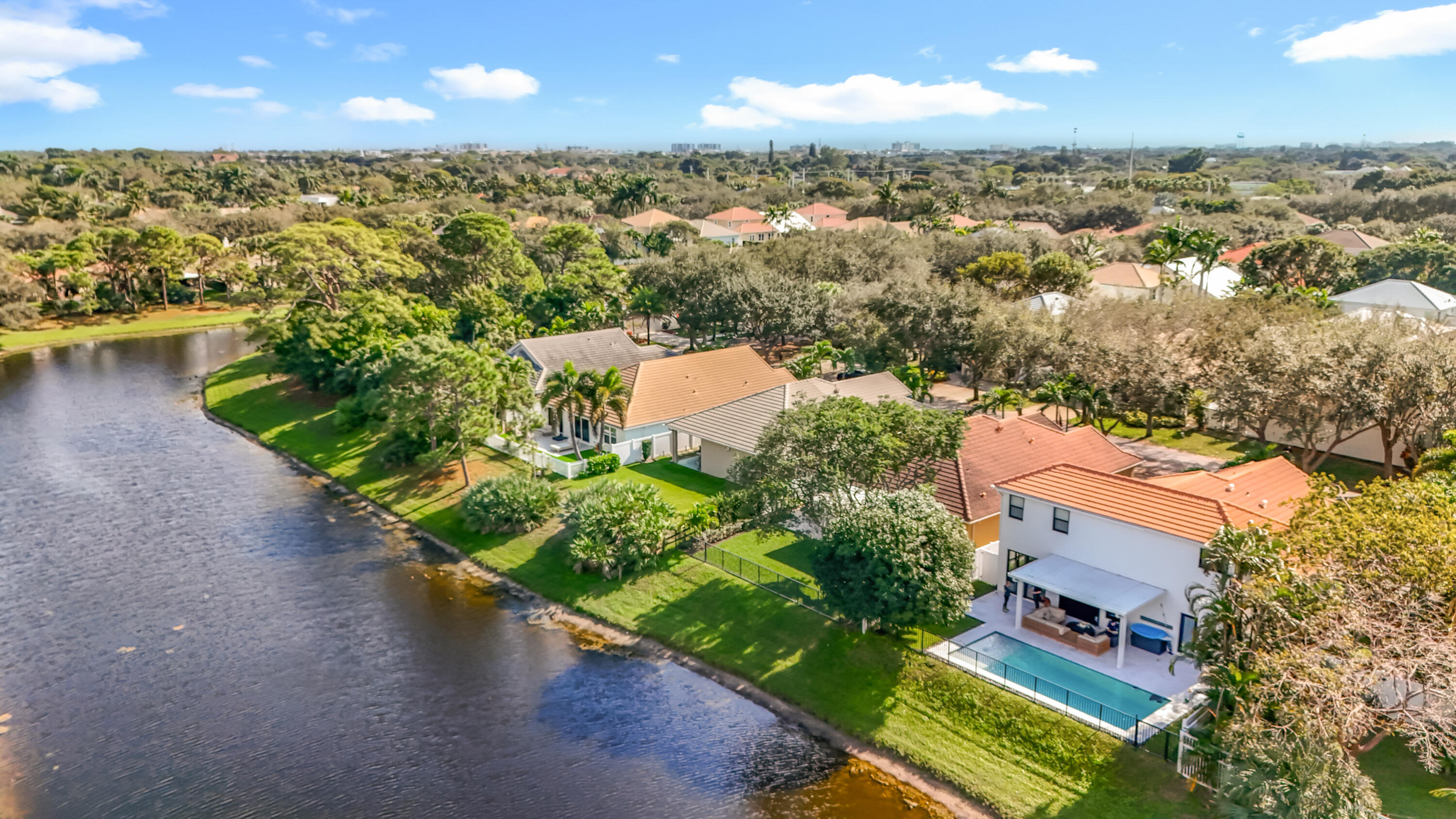 1143 Canoe Point Delray Beach, FL 33444 - Photo 74 of 85 an aerial view of residential houses with outdoor space and river