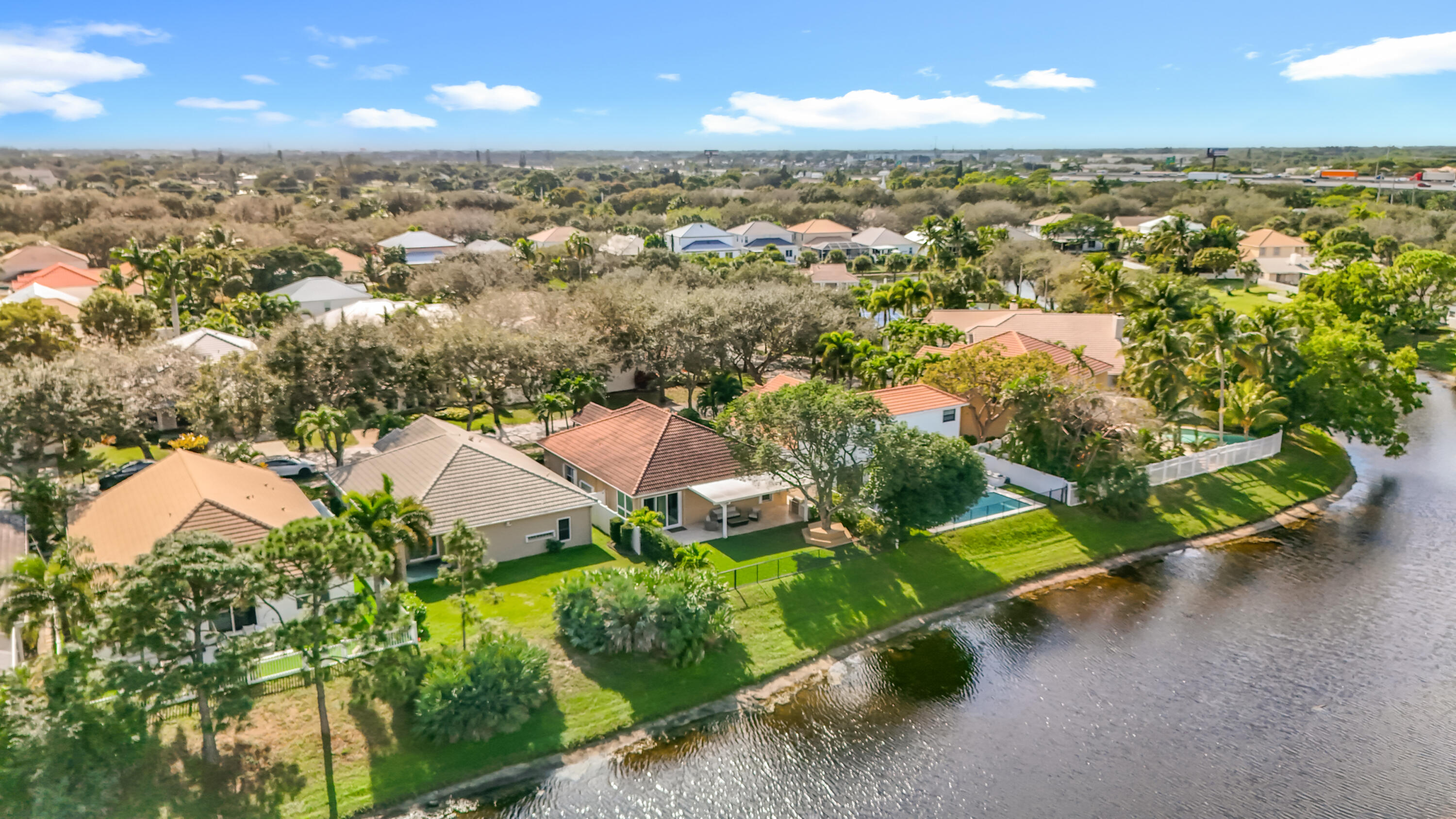 1143 Canoe Point Delray Beach, FL 33444 - Photo 79 of 85 an aerial view of residential houses with outdoor space and trees