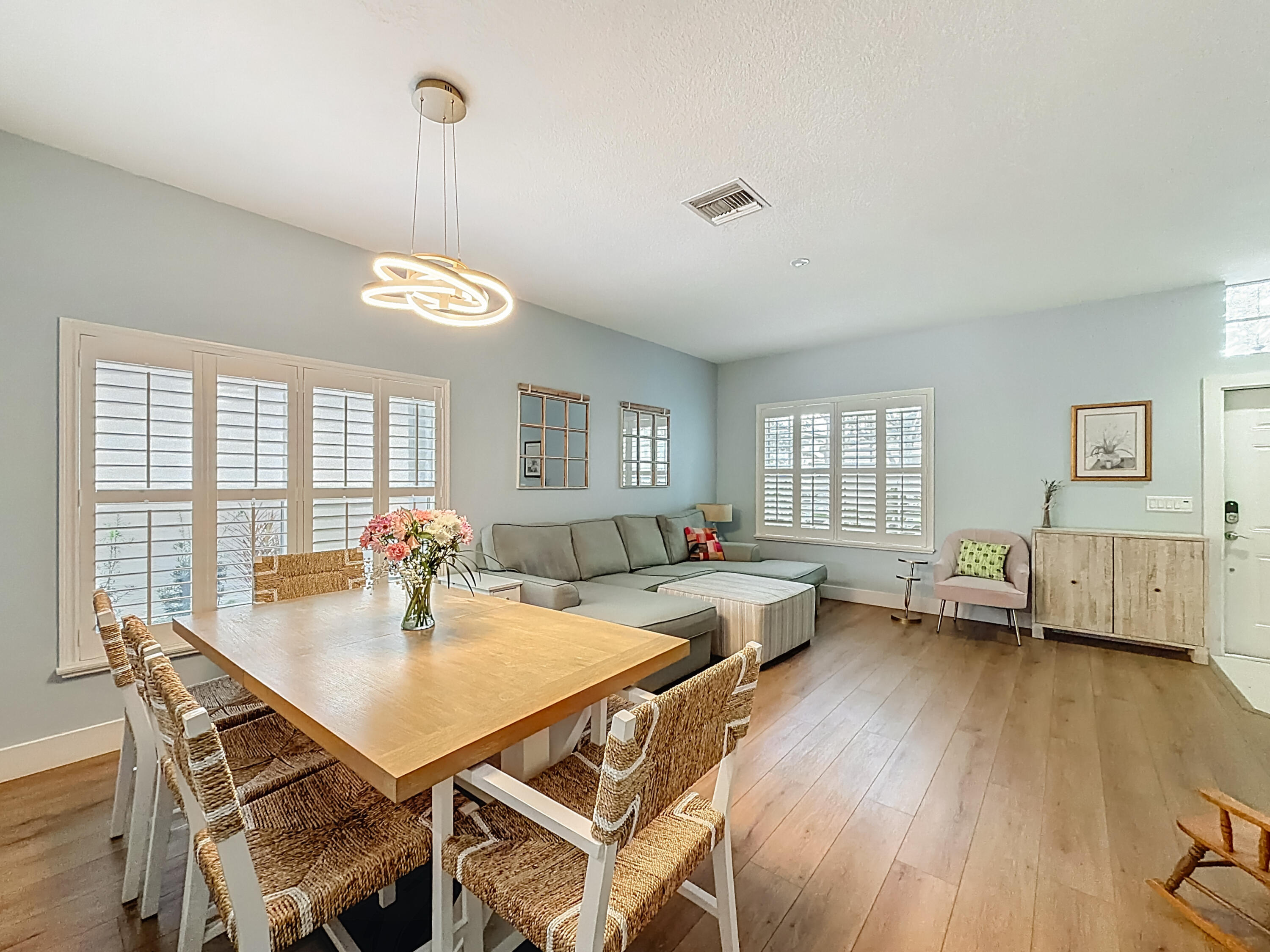 1143 Canoe Point Delray Beach, FL 33444 - Photo 8 of 85 a view of a dining room with furniture and wooden floor