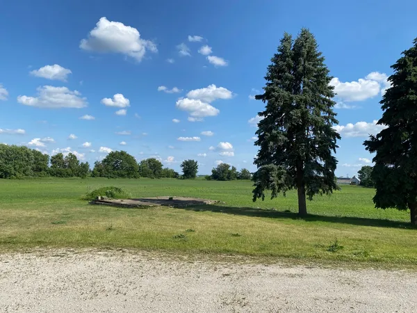 a view of a golf course with a lake