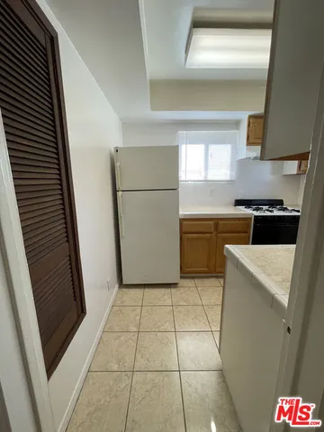 a kitchen with a stove a refrigerator a sink and dishwasher